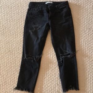 Destressed black jeans
